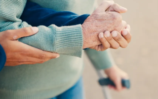 Park, walking and hands of caregiver with senior person for assisted living, support and care in nature.